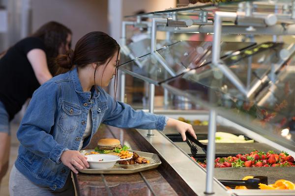 Dining halls feature food stations and salad bar